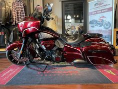 a red and black motorcycle is on display