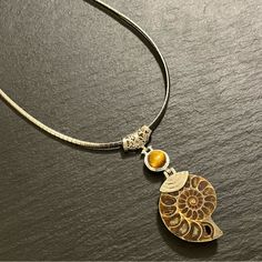 Natural Ammonite Fossil With Tigers Eye Stone Accent On 18” - 20” Omega Necklace Bohemian Natural Stunner New With Tag Marked 316l Ss Chain Length Is Approximately 18”-20” Please See All Photos As They Are Part Of The Description Feel Free To Contact Us With Any Questions Sp10 B61 Vera Wang Necklace, Ammonite Shell, Omega Necklace, Tigers Eye Stone, Pink Statement Necklace, Spider Necklace, Starburst Necklace, Multi Strand Beaded Necklace, Gold Starburst