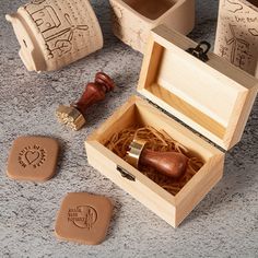 a wooden box with some rubber stamps in it and other items on the ground next to it