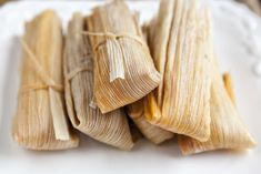 several tamales on a plate ready to be eaten