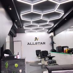 all star hair and beauty salon with modern lighting above the chair area for customers to sit in