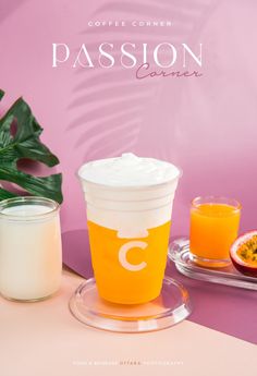 a cup of orange juice next to a glass of yogurt