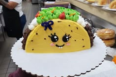 a taco cake sitting on top of a white plate