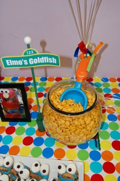 a table topped with lots of food and decorations