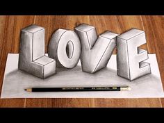 a drawing of the word love on paper with a pencil and marker next to it