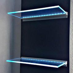 two glass shelves with blue lights on them