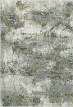 an area rug with various colors and patterns on the carpet, including grays, greens