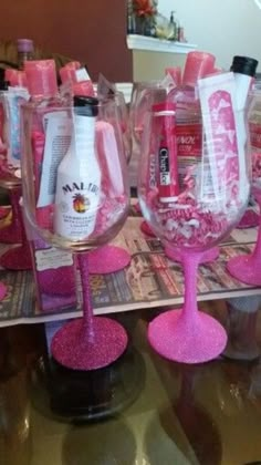 pink wine glasses are sitting on a table