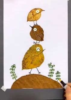 a drawing of three birds on top of a hill