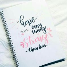 a spiral notebook with the words hope is the only thing strongr than beer on it