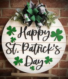 a st patrick's day sign hanging on a brick wall