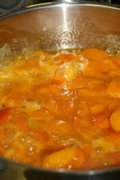 carrots are being cooked in a pot on the stove