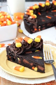 a slice of chocolate cake with candy corn on top