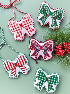 christmas decorations made out of fabric on a green surface