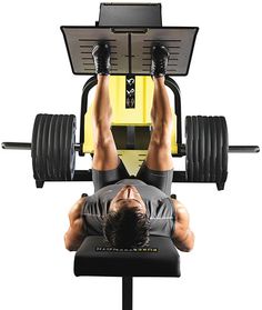 a man doing a bench press on a weight machine