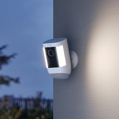 a security camera mounted on the side of a building