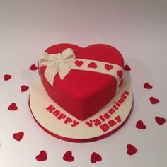 a heart shaped cake with the words happy valentine's day on it