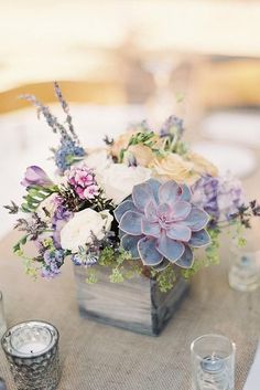 an image of a table setting with flowers and candles on the table for a social post