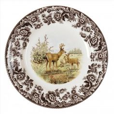 a brown and white plate with two deers on it