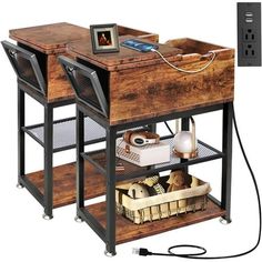 a computer desk sitting on top of a wooden shelf next to an electrical outlet and plugged in