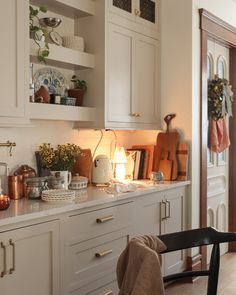 the kitchen is clean and ready to be used for cooking or baking, with dishes on the counter