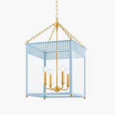 a blue and gold chandelier with three lights hanging from the ceiling in front of a white background