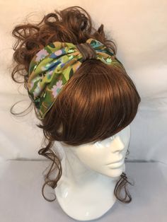 Fabric turban head band in a green floral retro cotton print,based on the 1940s land girl style and 1950s Rockabilly fashions. A real statement piece with a standard 1 inch width inner Alice band attached within the lining to provide an easy to wear design. Our range of turban bands are the perfect easy to wear accessory and are worn exactly as an Alice band finishing behind the ears. (These bands do not go all the way around the back of the head, so are perfect for all hair styles. This unique Vintage Spring Headband, Green Bohemian Headband Bandana, Adjustable Green Turban With Matching Headband, Bohemian Green Headwrap As Headband, Bohemian Green Headwrap Style Headband, Green Bohemian Bandana Headband, Retro Adjustable Headband For Spring, Vintage Adjustable Hair Accessories For Spring, Green Bohemian Headband