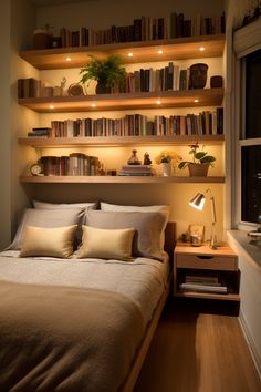 a bed sitting in a bedroom next to a window with bookshelves above it