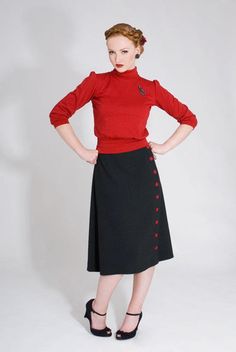 jersey shirt with polo neck-collar and puffed 3/4 sleeves. Vintage Winter Top With Collar, Retro Collared Polo Sweater For Fall, Vintage Sweater For Workwear, Retro Fitted Sweater With Button Closure, Solid Retro Tops For Fall, Retro Solid Tops For Fall, Retro Fitted Sweater For Work, Vintage Long Sleeve Sweater For Work, Retro Polo Collar Tops For Fall