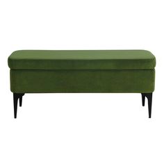 a green bench sitting on top of a white floor next to a black leg rest