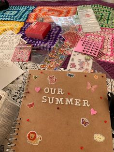 a notebook with the words our summer written on it surrounded by other crafting supplies