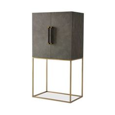 a gray cabinet with gold trimmings and a mirror on the bottom, in front of a white background