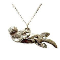 Float Awaylet The Waves Rock You To Sleep. Fine Pewter Sea Otter Necklace, Enhydra Lutris. This Sculpted Pewter Mother Sea Otter & Baby Pendant Is Expertly Crafted Into Functional Wildlife Art, Sure To Please The Incredibly Dense Furred And Protected Marine Animal. 1.9 Inches ( 4.8 Cm) Long X .6 Inches (1.4 Cm) Tall. . 18 Inch (45 Cm) Silvertone Chain 2 Inches (5 Cm) Extender Chain Adjustable To 20 Inches (51 Cm) Closes Lobster Claw Clasp. Handmade Necklace. Otter Necklace, Otter Jewelry, Blue Stone Necklace, Napier Jewelry, Baby Necklace, Wax Carving, Rhinestone Statement Necklace, Nature Necklace, Stacked Necklaces