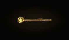 a golden key with flames on it in the dark