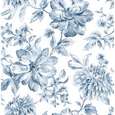 a blue and white floral wallpaper with large flowers on the left side of it