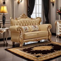 an elegant living room with gold furniture