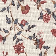 a close up view of the fabric with red and blue flowers on white groundcloth