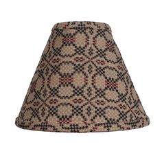 a lampshade with a pattern on the bottom and red, black, and white designs