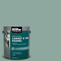 a brown paint can with the words behr premium on it and an image of a cabinet