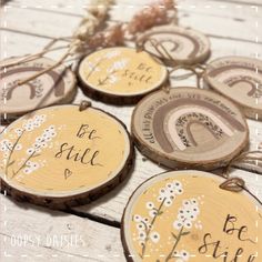 wood slices with words on them sitting on a table