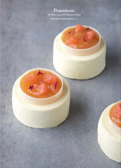 three small desserts sitting on top of a table