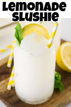 a lemonade slushie is garnished with mint and sliced lemons