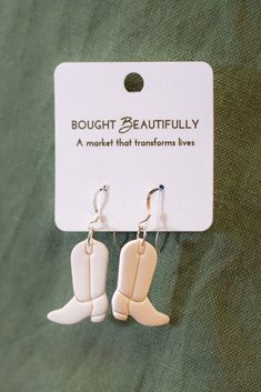 Made with love in Baton Rouge, Louisiana ♥ The Cowboy Boot Earrings were made with love by our partners Hands Producing Hope, an ethical fashion brand empowering women to rise above poverty, by providing the economic, educational, and spiritual resources necessary to empower remote communities. Their vision is to see all people afforded opportunities to have dignified and respectable work and to provide for their families and flourish in their communities. Cowboy Boot Earrings, Boot Earrings, Baton Rouge Louisiana, Earrings Aesthetic, Ethical Fashion Brands, The Cowboy, Rise Above, Ceramic Candle, Western Boho