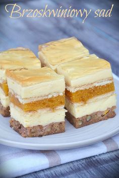 four pieces of cake sitting on top of a white plate