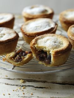 several small pies on a wire rack