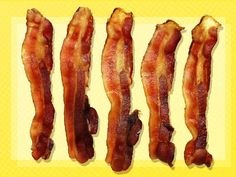 bacon strips are lined up on a yellow background