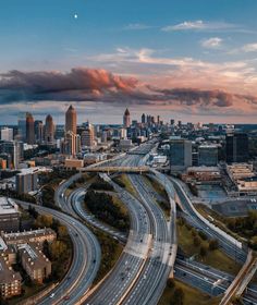 an aerial view of a city with many traffic on it's streets and roads