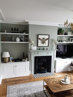 a living room filled with furniture and a fire place