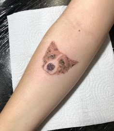 a dog's face is shown on the arm