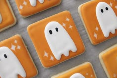 halloween cookies decorated with white icing and ghost faces